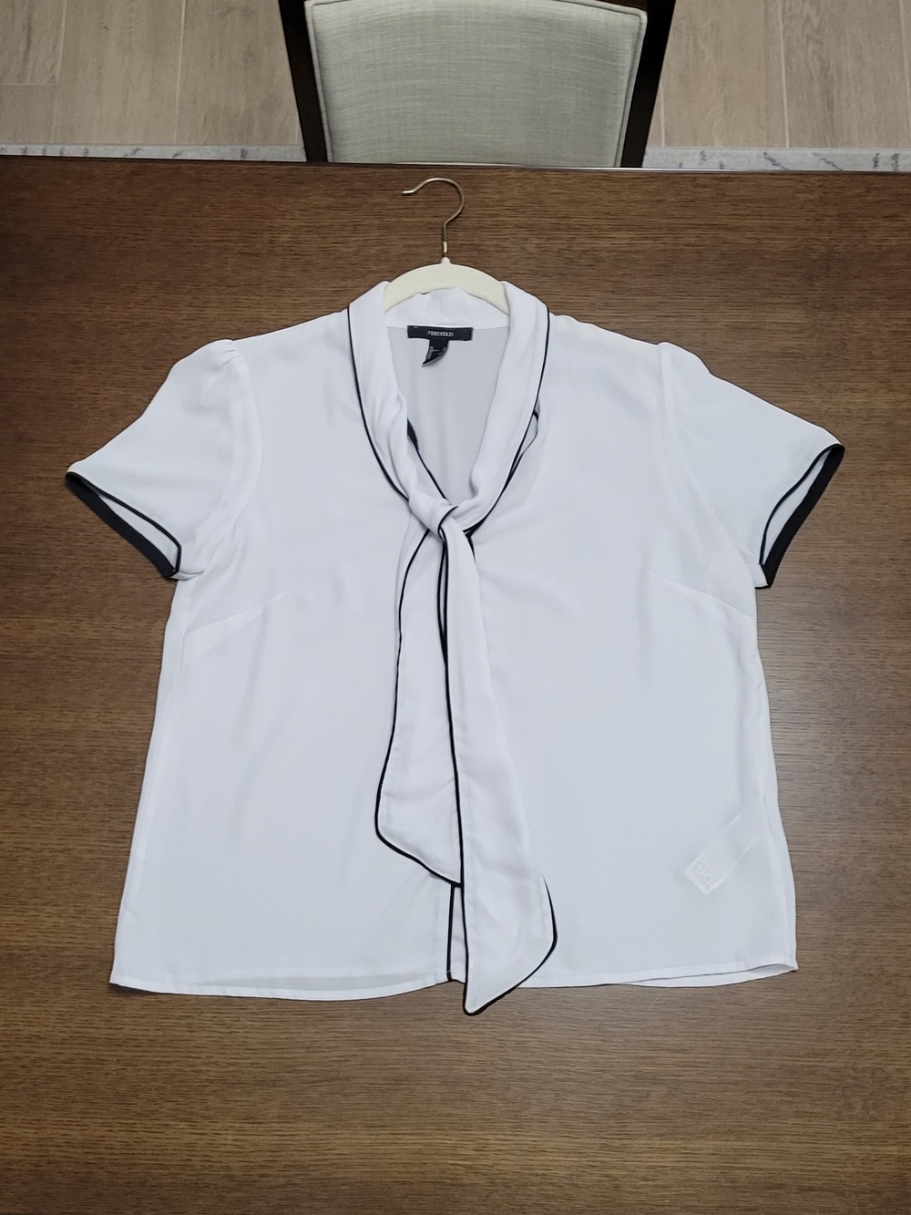 White Short-Sleeve Tie-Neck Blouse with Black Trim